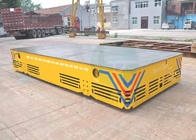 Battery operated steerable motorized trackless transfer car on cement floor