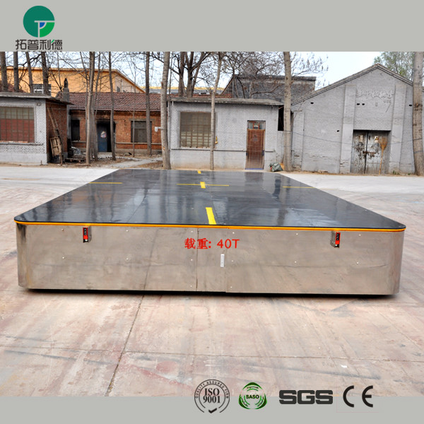 Battery operated steerable motorized trackless transfer car on cement floor