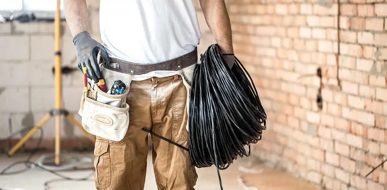 What tools are needed to pull wires through an electrical conduit?